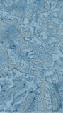 A close-up of a blue and off white cotton batik fabric