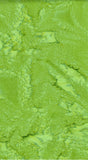 A close-up of a marbled lime green and yellow-green textured surface,  cotton batik fabric