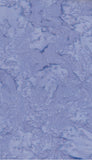 A close-up of cotton batik fabric with a mottled, marbled pattern in light periwinkle blue and white.