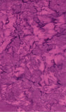 A close-up of a mottled magenta and purple textured surface, cotton batik fabric.