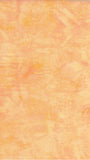 Textured peach-colored cotton batik fabric with a subtle pattern