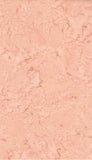A close-up of a textured, cotton batik fabrics in light terracotta tones