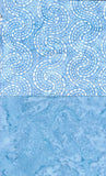 Two blue cotton batik fabric swatches with different patterns on a white background