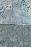 Textured blue and gray surface with circular patterns