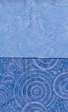 Blue textured fabric with circular patterns