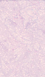 A close-up of a light lavender and pale pink textured surface with scattered small white dots and a soft marbled pattern.
