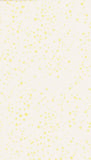 A close-up of a light cream or off-white surface with scattered small pale yellow dots or speckles.