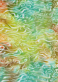 Abstract swirling, wavy lines in shades of green, yellow, teal, orange, and white cotton batik fabric