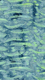 A close-up of a cotton batik fabric featuring repeating light green gum leaves motifs over a mottled blue and gray background.