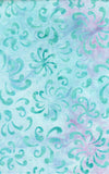 A close-up of a batik fabric pattern featuring teal watercolor swirls and floral motifs over a light blue and pink watercolor background.