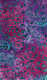 A close-up of a batik fabric pattern featuring stylized flowers and leaves in vibrant magenta pink and deep purple with teal-green accents.