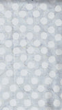 Pale Blue gray polka dot patterned fabric with a light blue-gray background.