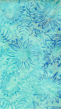 A close-up of a batik fabric pattern featuring blue watercolor floral and leaf motifs on a light turquoise background.