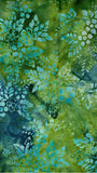 Batik Fabric with blue and green floral pattern on a green background