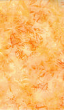 Floral pattern on a yellow and orange background cotton batik fabric