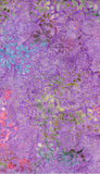 A close-up of a batik fabric pattern featuring abstract watercolor floral motifs in shades of purple, lavender, teal, sage green, and pink with gold foil dot accents.