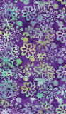 Floral pattern with green and purple on a purple background cotton batik fabric