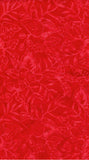 Red batik fabric with a tonal floral and leaf pattern, showing a textured jacquard weave.