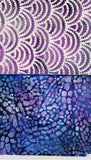 Two batik fabric swatches displayed side-by-side. The top fabric features a purple and white scalloped wave pattern, while the bottom fabric has a blue, purple, and black spotted leopard-like pattern.