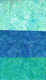 Three swatches of blue and green cotton batik fabric with a swirling pattern.