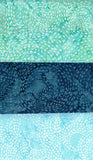 Three swatches of cotton batik fabric with blue and green patterns