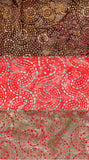Three different patterns of cotton batik fabric swatches in brown, red, and beige.