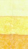 Three Fat Quarters of batik fabric in pale yellow, golden yellow, and mustard yellow, each with a subtle floral or geometric embossed pattern.