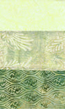 3 Fat Quarters of patterned batik fabric: a pale yellow-green textured top band, a semi-sheer light green middle band with white floral motifs, and a darker green lower band with repeating wave-like scroll patterns.