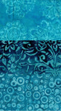 Blue batik fabric with three horizontal bands of different patterns: a light blue floral mandala pattern on top, a dark blue and black floral scroll pattern in the middle, and a light blue concentric circle pattern on the bottom.