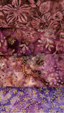 Four Fat Quarters of batik fabric patterns in shades of purple, pink, and brown, featuring floral, leaf, and abstract dot designs.