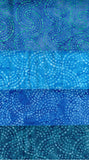 Four horizontal bands of batik fabric in shades of blue and teal, each featuring a unique circular dotted swirl pattern.